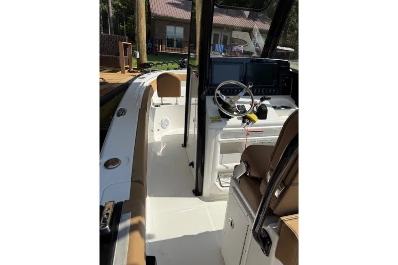 Slide: The Image of 2020 Sea Hunt Ultra 255SE boat interior with steering console and seating. - 15