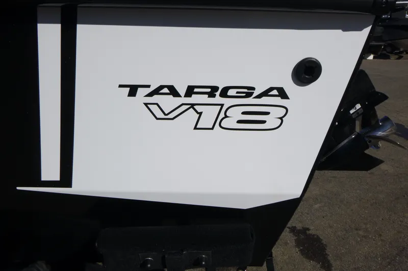 Slide: The Image of 2027 Tracker Targa V-18 Combo boat logo on white surface. - 16