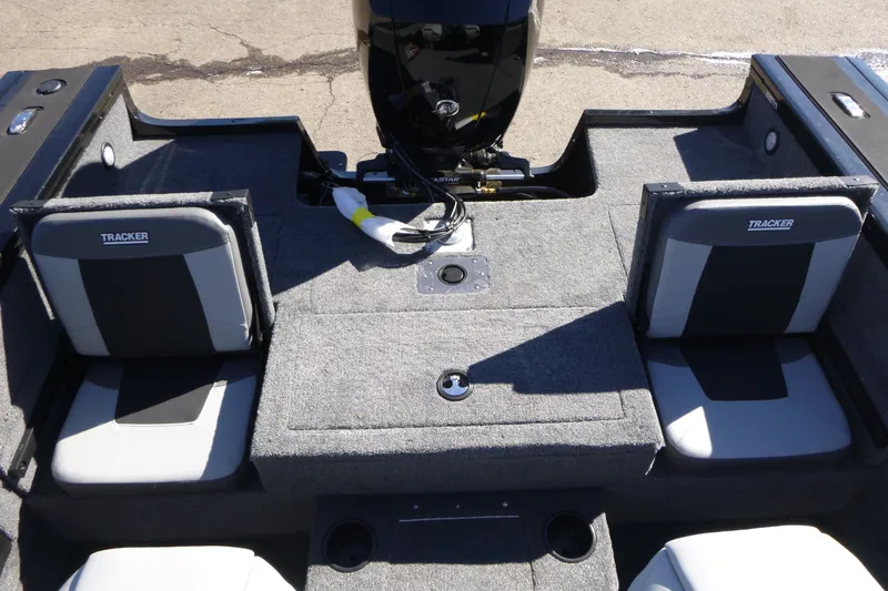 Slide: The Image of 2027 Tracker Targa V-18 Combo boat interior with gray seating and motor. - 13