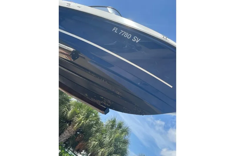 Slide: The Image of 2021 Bayliner VR6 Bowrider OB boat with registration FL 7780 SV, under clear blue sky. - 8