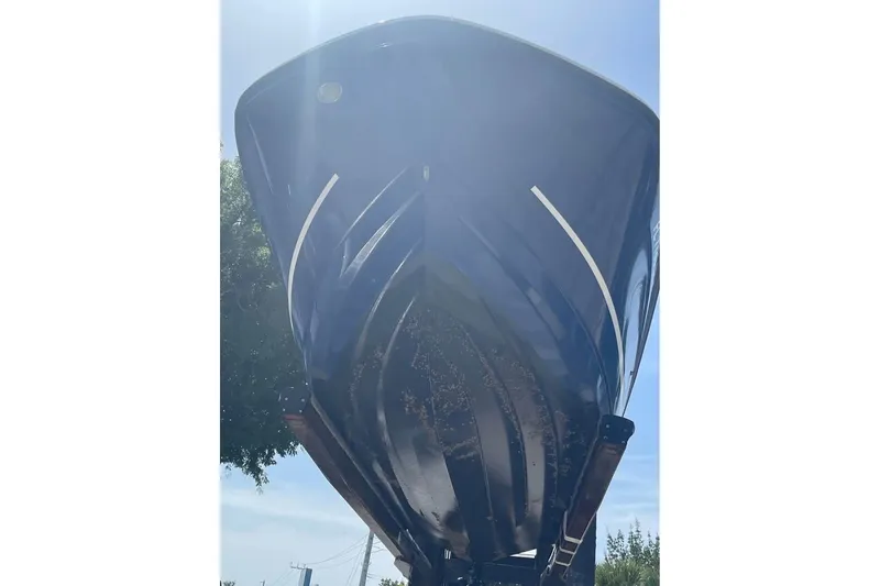 Slide: The Image of 2021 Bayliner VR6 Bowrider OB boat hull viewed from below, showcasing sleek design. - 7