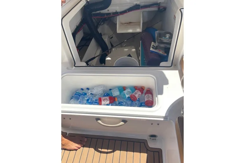 Slide: The Image of 2021 Bayliner VR6 Bowrider OB cooler with drinks and ice on deck. - 14