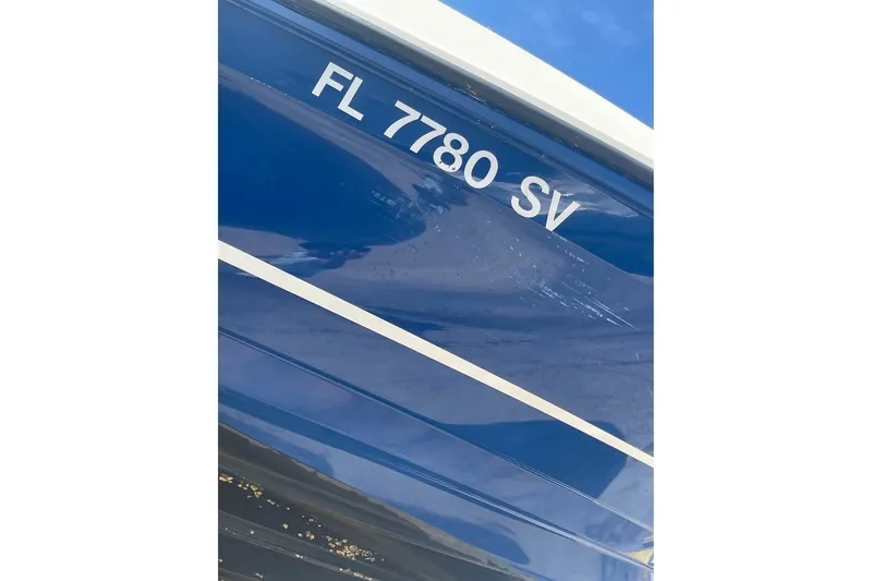 Slide: The Image of 2021 Bayliner VR6 Bowrider OB with registration FL 7780 SV, blue hull detail. - 10