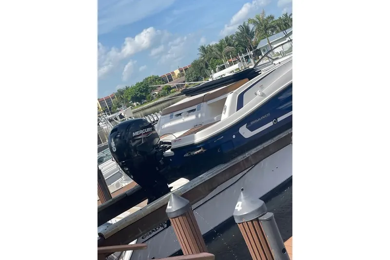 Slide: The Image of 2021 Bayliner VR6 Bowrider OB with Mercury outboard motor docked at marina. - 11