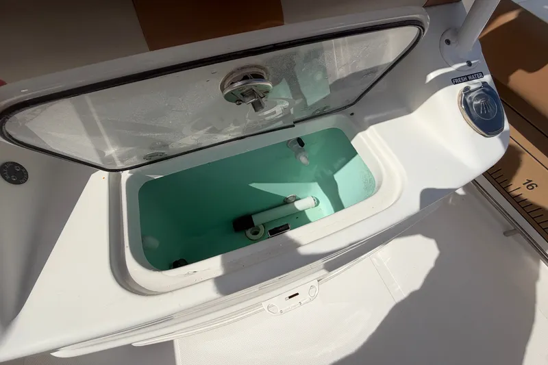 Slide: The Image of Livewell on 2023 NauticStar 2602 Legacy boat, featuring fresh water access. - 15