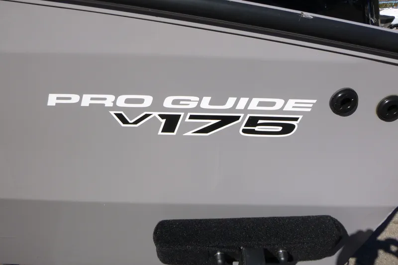 Slide: The Image of 2027 Tracker Pro Guide V-175 Combo boat logo on gray hull. - 13