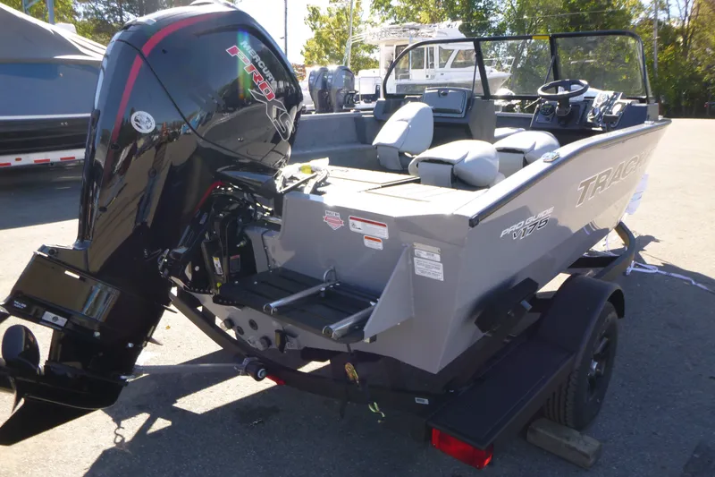 The Image of 2027 Tracker Pro Guide V-175 Combo boat with Mercury Pro XS engine, parked outdoors. - 0