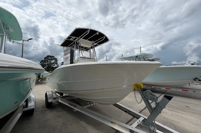 Slide: The Image of 2027 Bulls Bay 200 Center Console boat on trailer under cloudy sky. - 1