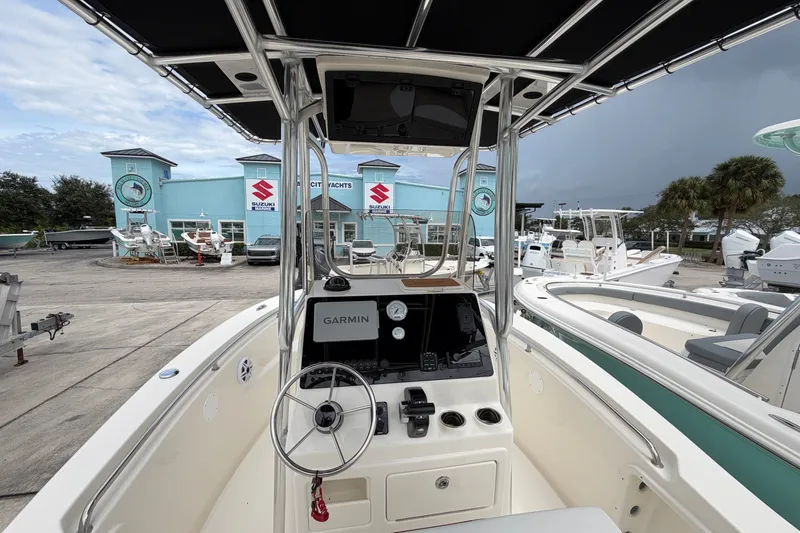 Slide: The Image of 2027 Bulls Bay 200 Center Console boat at marina with Garmin navigation system. - 5