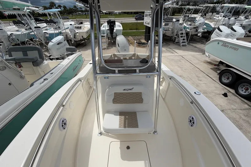 Slide: The Image of 2027 Bulls Bay 200 Center Console boat at a marina, surrounded by other vessels. - 9