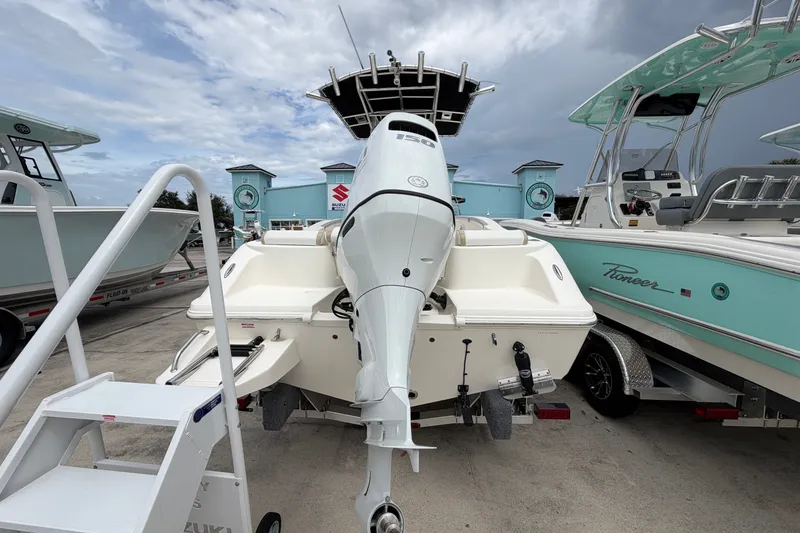 Slide: The Image of 2027 Bulls Bay 200 Center Console boat with powerful outboard motor, displayed at a marina. - 3