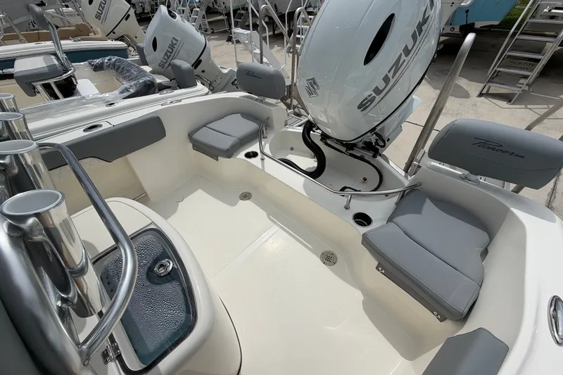 Slide: The Image of 2027 Pioneer 202 Sportfish boat interior with Suzuki engine and seating. - 13