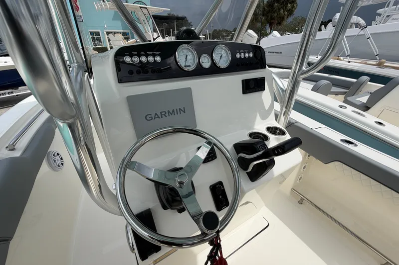 Slide: The Image of Steering console of 2027 Pioneer 202 Sportfish boat with Garmin navigation system. - 6