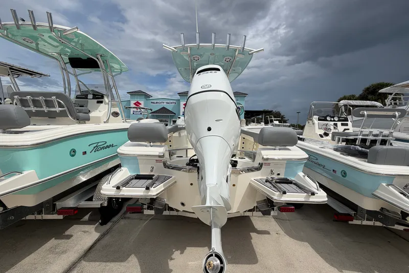 Slide: The Image of 2027 Pioneer 202 Sportfish boat with outboard motor, displayed at Palm City Yachts dealership. - 3