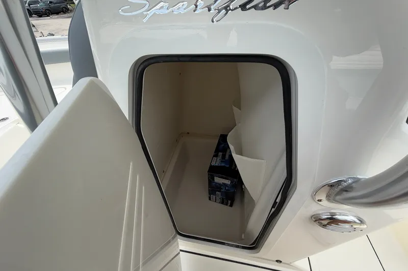 Slide: The Image of Open storage compartment on 2027 Pioneer 202 Sportfish boat, showing interior space. - 11