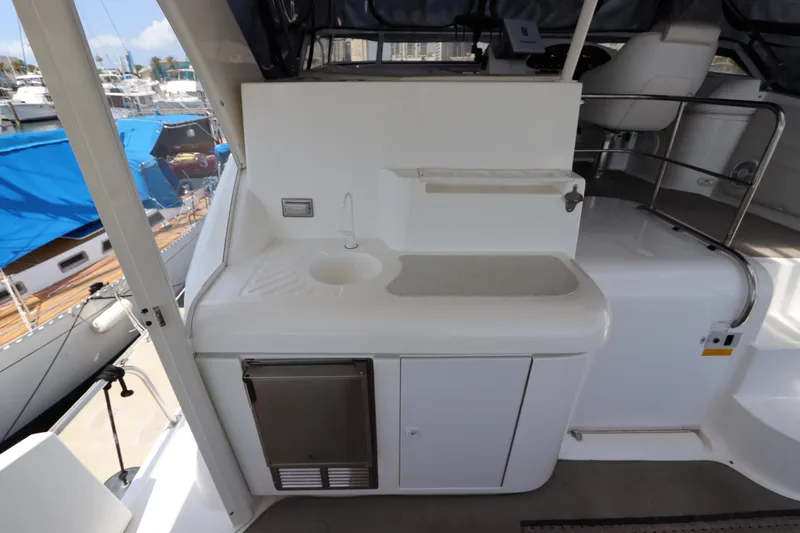 Slide: The Image of 1999 Cruisers Yachts 3750 Motoryacht interior with sink and storage area. - 16