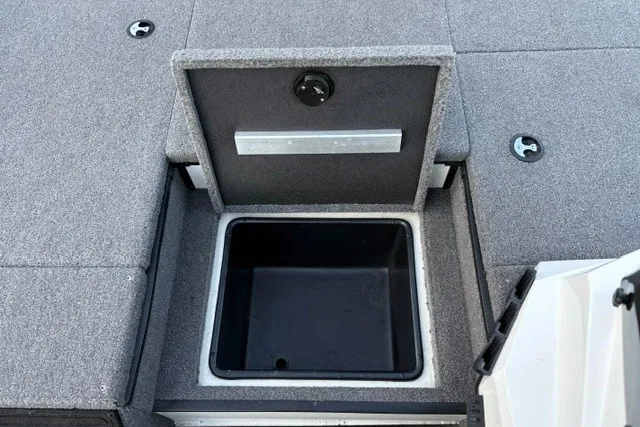 Slide: The Image of Ranger ALPHA 208 2025 boat storage compartment with open lid, showcasing interior space. - 42