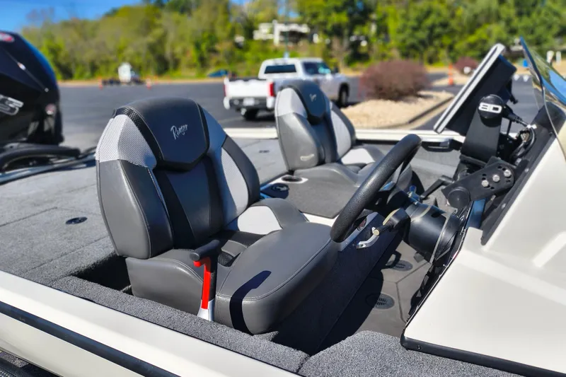 Slide: The Image of 2025 Ranger ALPHA 208 boat interior with steering wheel and comfortable seating. - 22