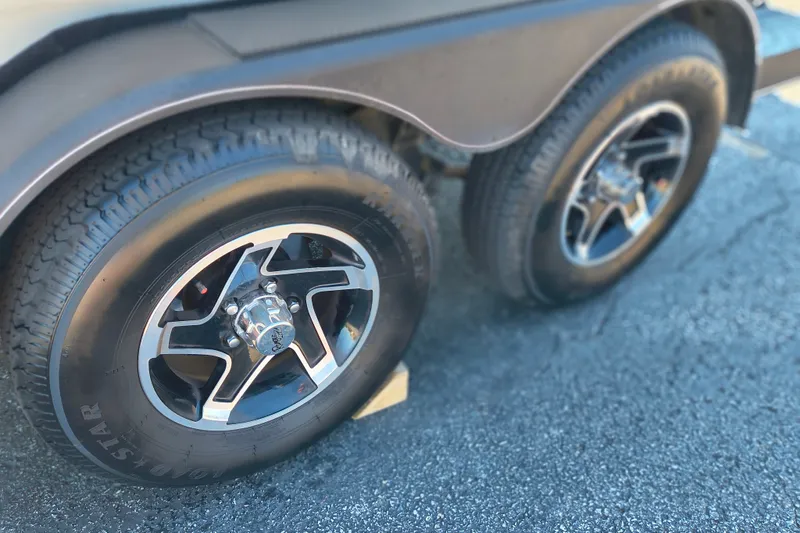 Slide: The Image of Close-up of 2025 Ranger ALPHA 208 wheels on asphalt surface. - 30