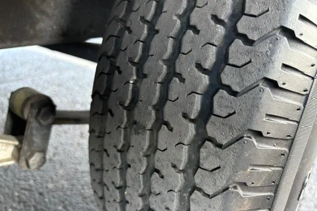 Slide: The Image of Close-up of a Ranger ALPHA 208 tire tread, 2025 model, showing wear pattern. - 74