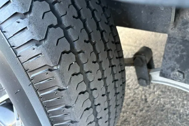 Slide: The Image of Close-up of a Ranger ALPHA 208 tire, showcasing tread pattern, 2025 model. - 78