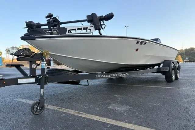 Slide: The Image of 2025 Ranger ALPHA 208 boat on trailer in parking lot, side view. - 9