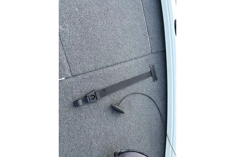 Slide: The Image of Carpeted deck of 2025 Ranger ALPHA 208 boat with strap and cable. - 40