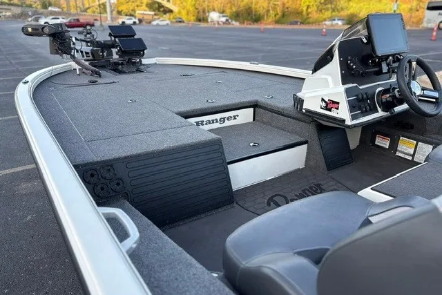Slide: The Image of 2025 Ranger ALPHA 208 boat interior with advanced navigation system and spacious seating. - 35