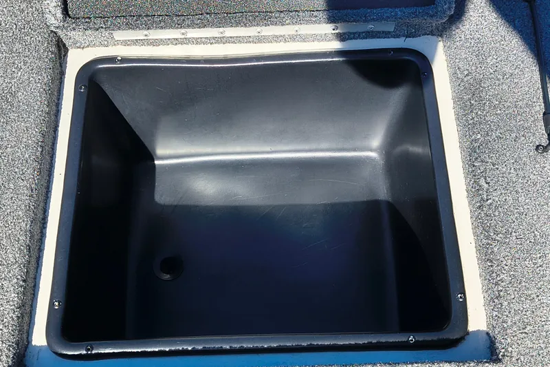 Slide: The Image of Storage compartment of 2025 Ranger ALPHA 208 boat, featuring a spacious, black interior. - 15