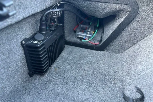 Slide: The Image of Interior view of a 2025 Ranger ALPHA 208, showcasing electronic components and wiring. - 59