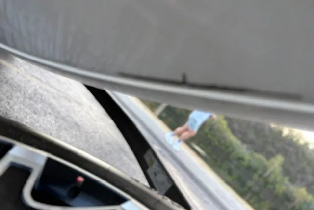 Slide: The Image of Blurry view of Ranger ALPHA 208 interior, 2025 model, with person in background. - 57