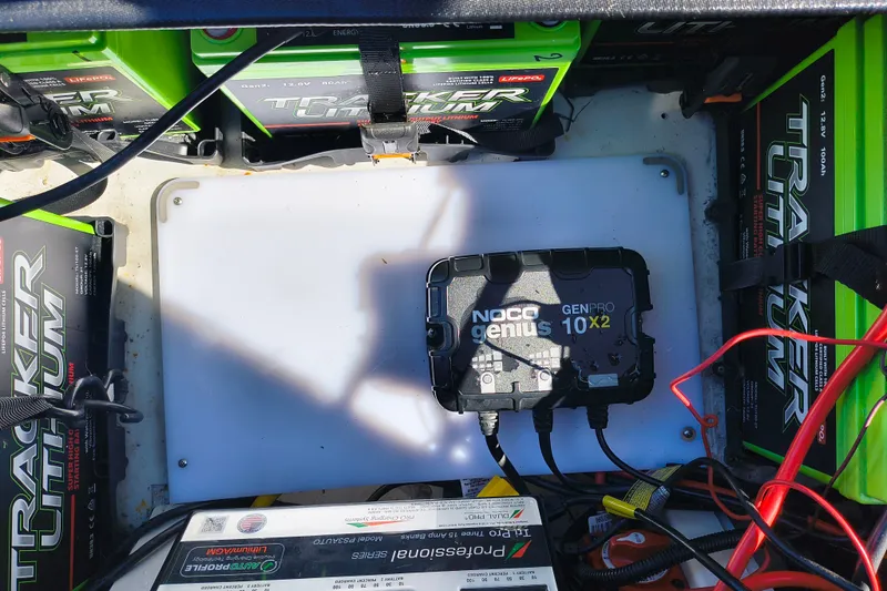 Slide: The Image of Battery setup in Ranger ALPHA 208, featuring NOCO Genius GENPRO 10X2 charger, 2025 model. - 28