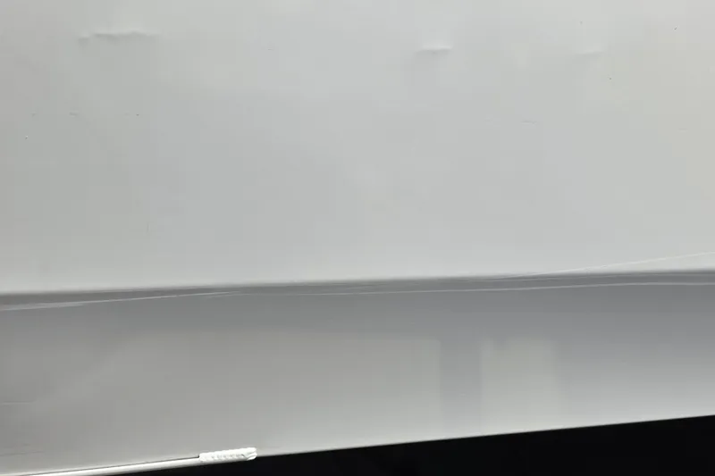 Slide: The Image of Close-up of a white surface, possibly part of a 2025 Ranger ALPHA 208. - 43