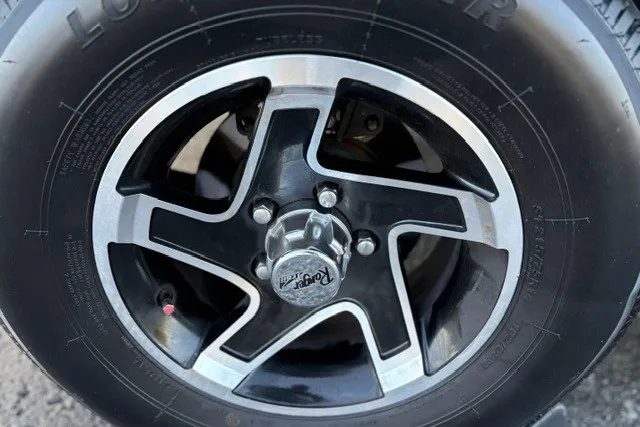 Slide: The Image of Close-up of a 2025 Ranger ALPHA 208 wheel with a stylish black and silver rim. - 77
