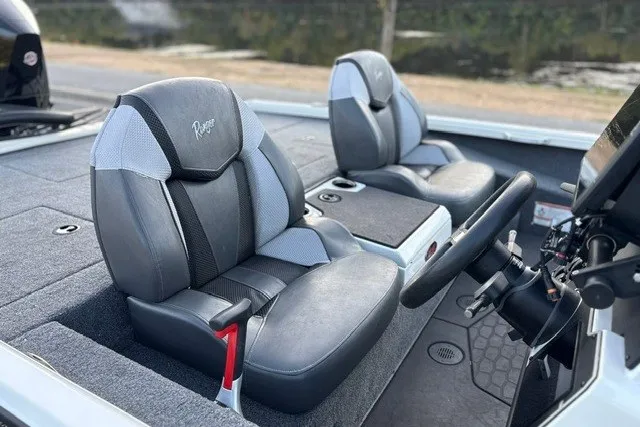 Slide: The Image of 2025 Ranger ALPHA 208 boat interior with sleek, modern seating and steering console. - 29