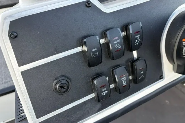 Slide: The Image of Control panel of Ranger ALPHA 208, 2025 model, featuring various switches and a key slot. - 53