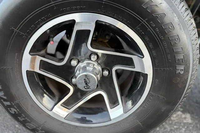 Slide: The Image of Ranger ALPHA 208 2025 model wheel with black and silver alloy rim design. - 73