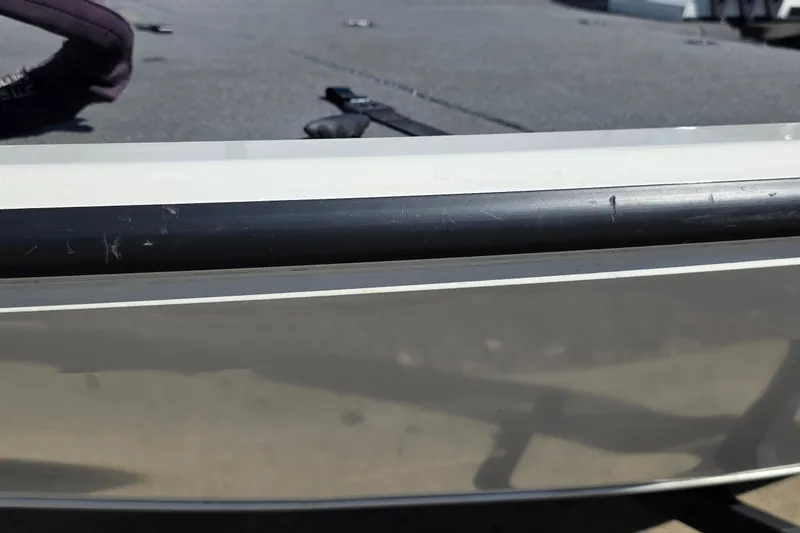 Slide: The Image of Close-up of 2025 Ranger ALPHA 208 boat hull with visible scratches. - 47