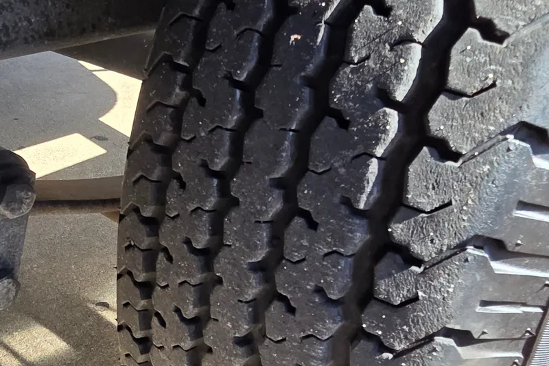Slide: The Image of Close-up of a 2025 Ranger ALPHA 208 tire tread pattern. - 42