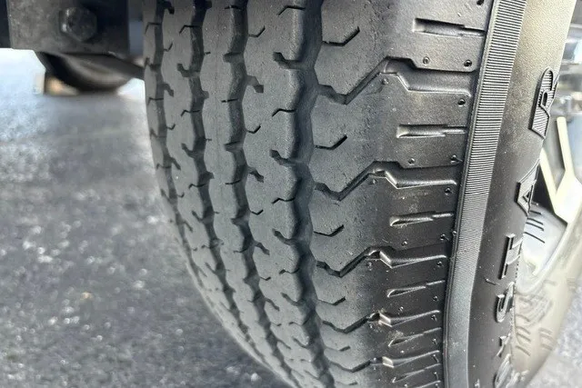 Slide: The Image of Close-up of a Ranger ALPHA 208 tire, showcasing tread pattern, 2025 model. - 72
