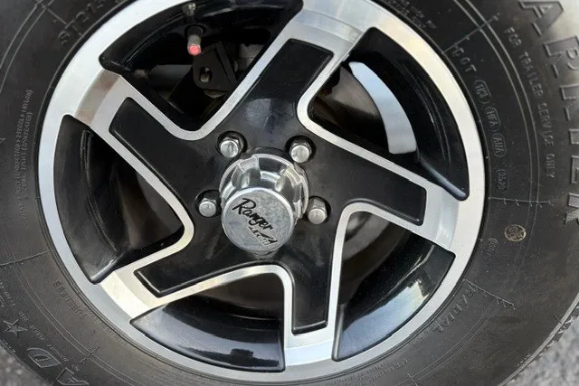 Slide: The Image of Close-up of a 2025 Ranger ALPHA 208 wheel with black and silver alloy design. - 75