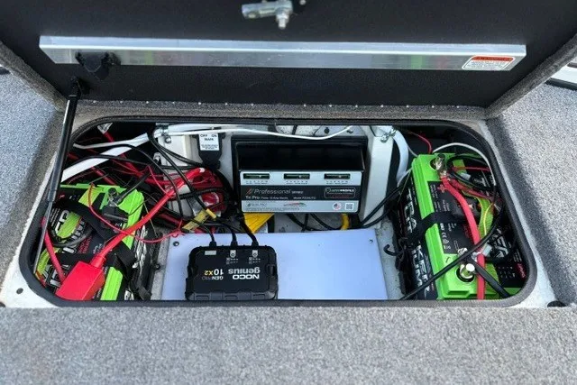 Slide: The Image of Battery compartment of 2025 Ranger ALPHA 208, featuring wiring and charging systems. - 71
