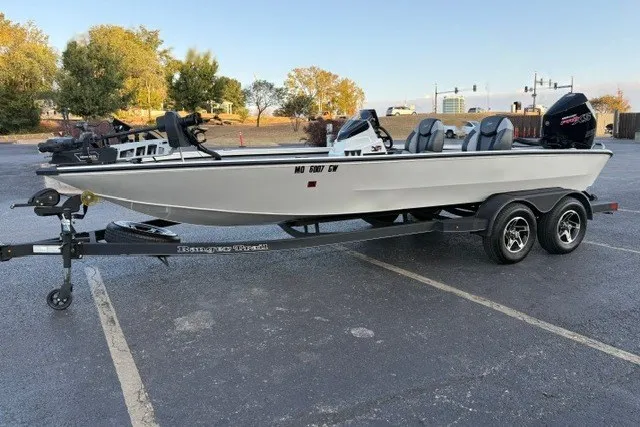 Slide: The Image of 2025 Ranger ALPHA 208 boat on trailer in parking lot, side view. - 4
