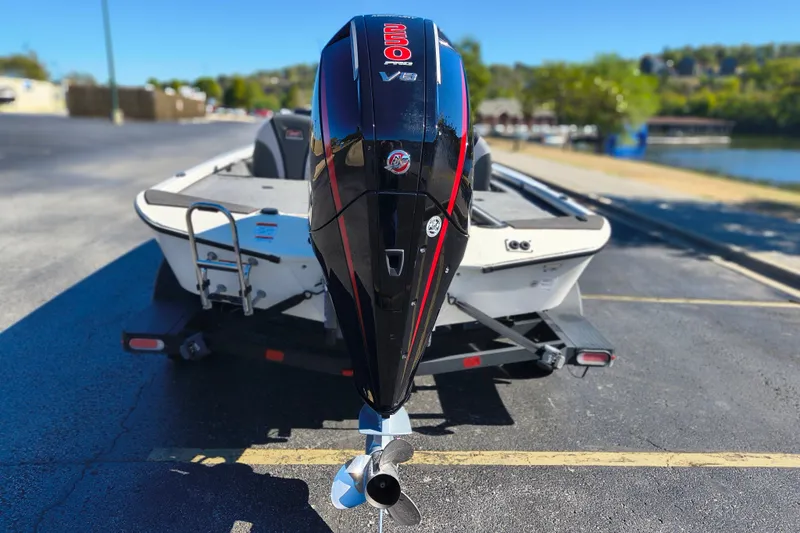 Slide: The Image of Ranger ALPHA 208 boat with powerful V8 engine, parked near a scenic lake, 2025 model. - 34