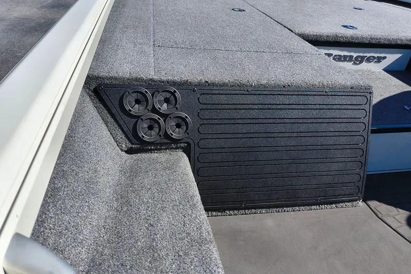 Slide: The Image of 2025 Ranger ALPHA 208 boat deck with carpeted surface and speaker system. - 14