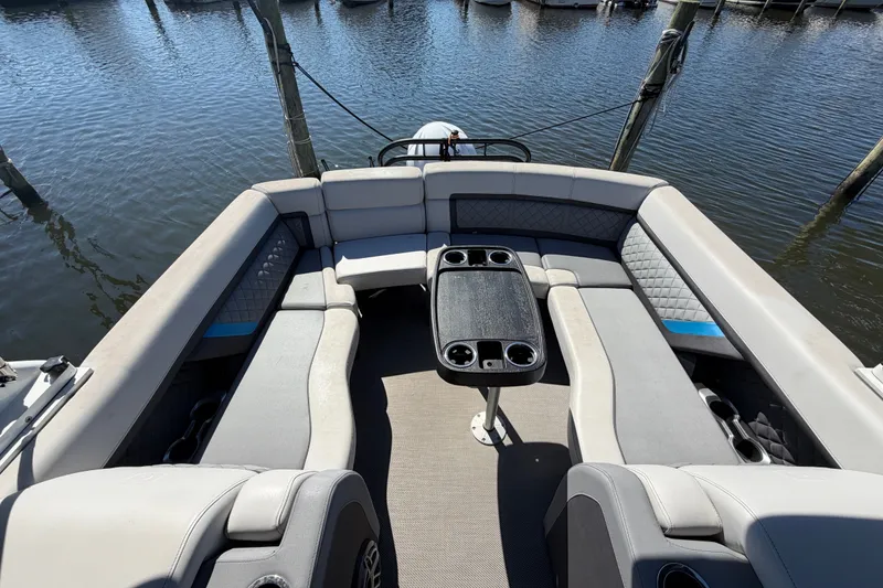 Slide: The Image of Luxurious seating area on 2023 Godfrey AquaPatio 255 ULC pontoon boat at dock. - 16