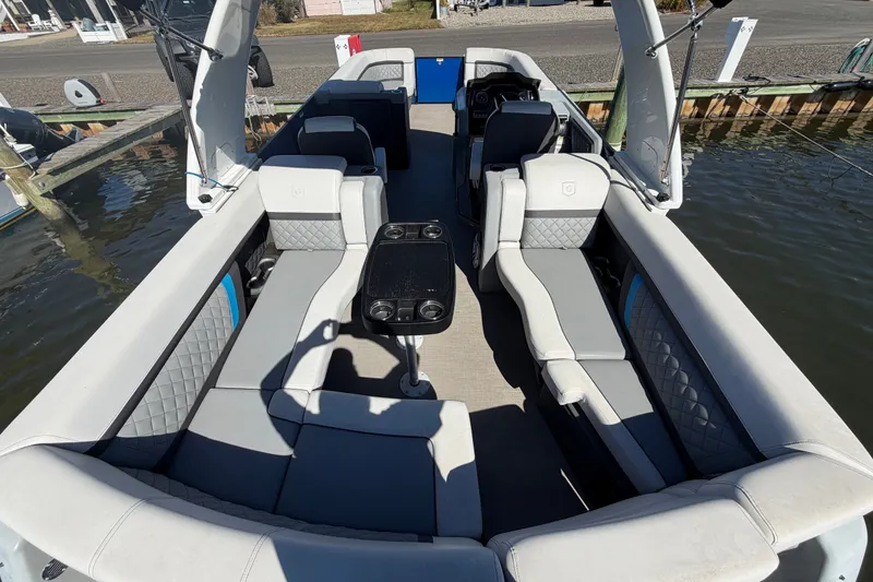 Slide: The Image of 2023 Godfrey AquaPatio 255 ULC pontoon boat with luxurious seating and central table. - 19