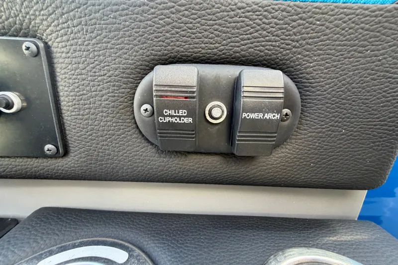 Slide: The Image of Control panel with chilled cupholder and power arch switches on 2023 Godfrey AquaPatio 255 ULC. - 25