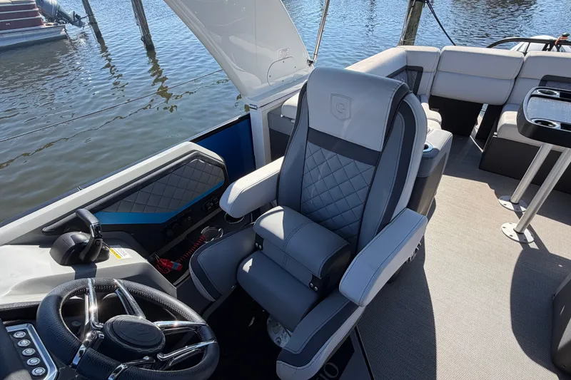 Slide: The Image of Luxurious seating on 2023 Godfrey AquaPatio 255 ULC pontoon boat, featuring elegant design and comfort. - 13