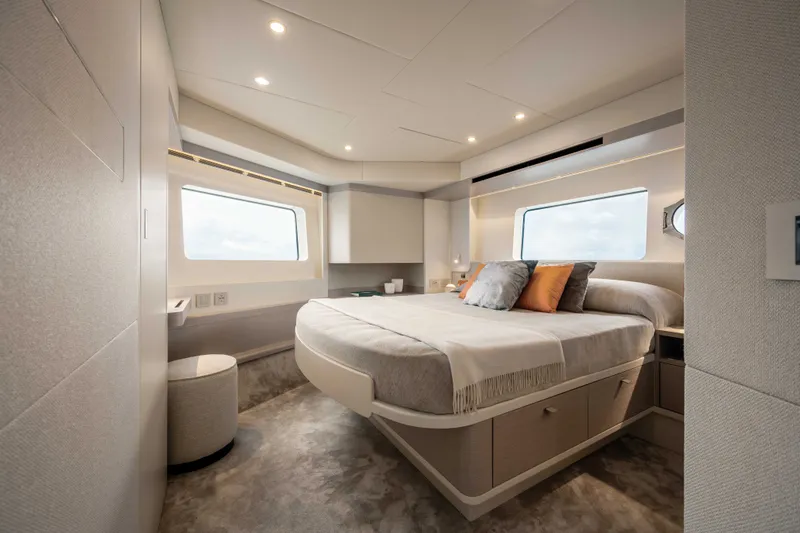 Slide: The Image of Luxurious cabin of the Absolute Navetta 50 with a large bed and panoramic windows. - 11